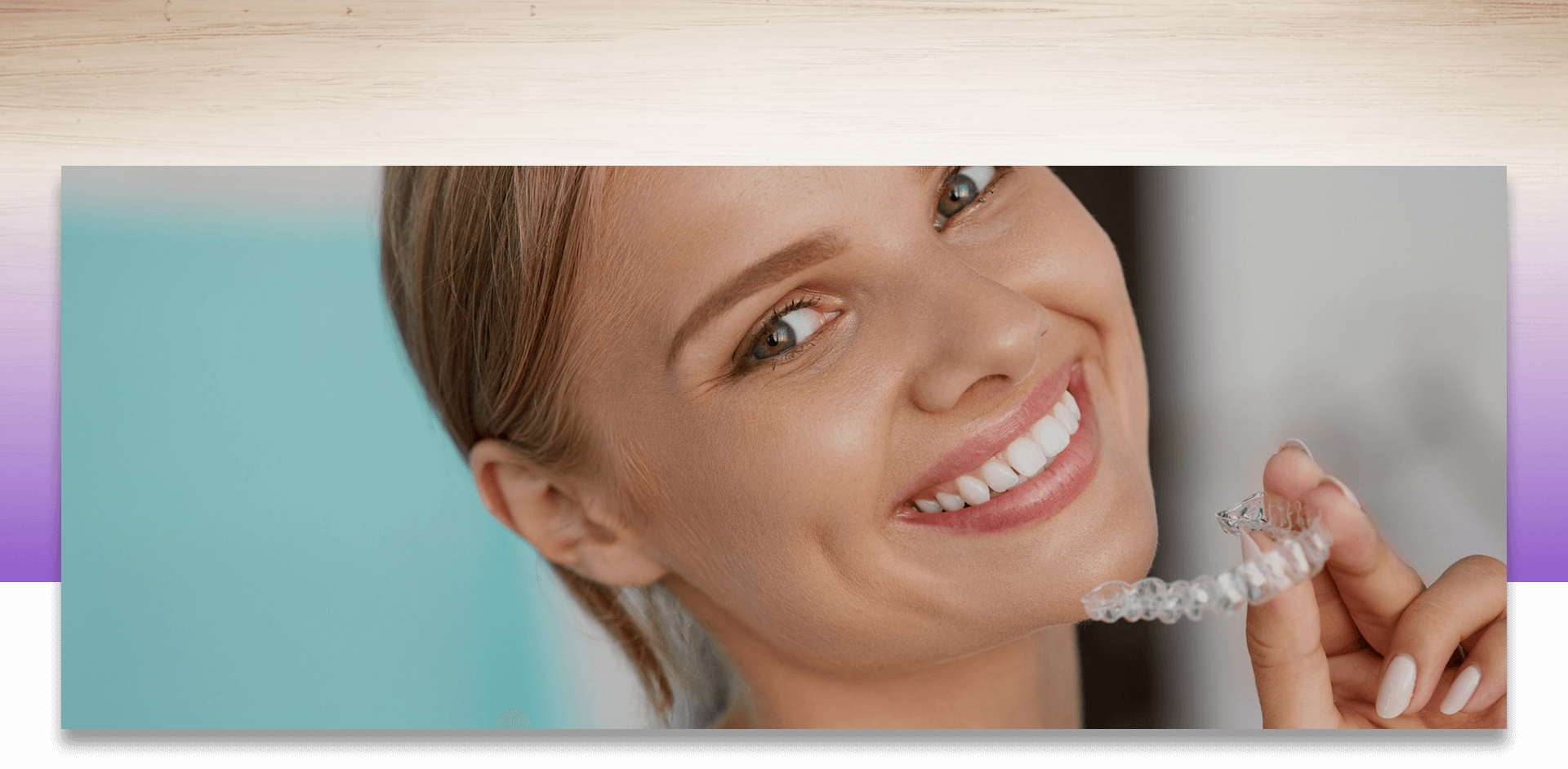 Smiling woman holding dental prosthetic